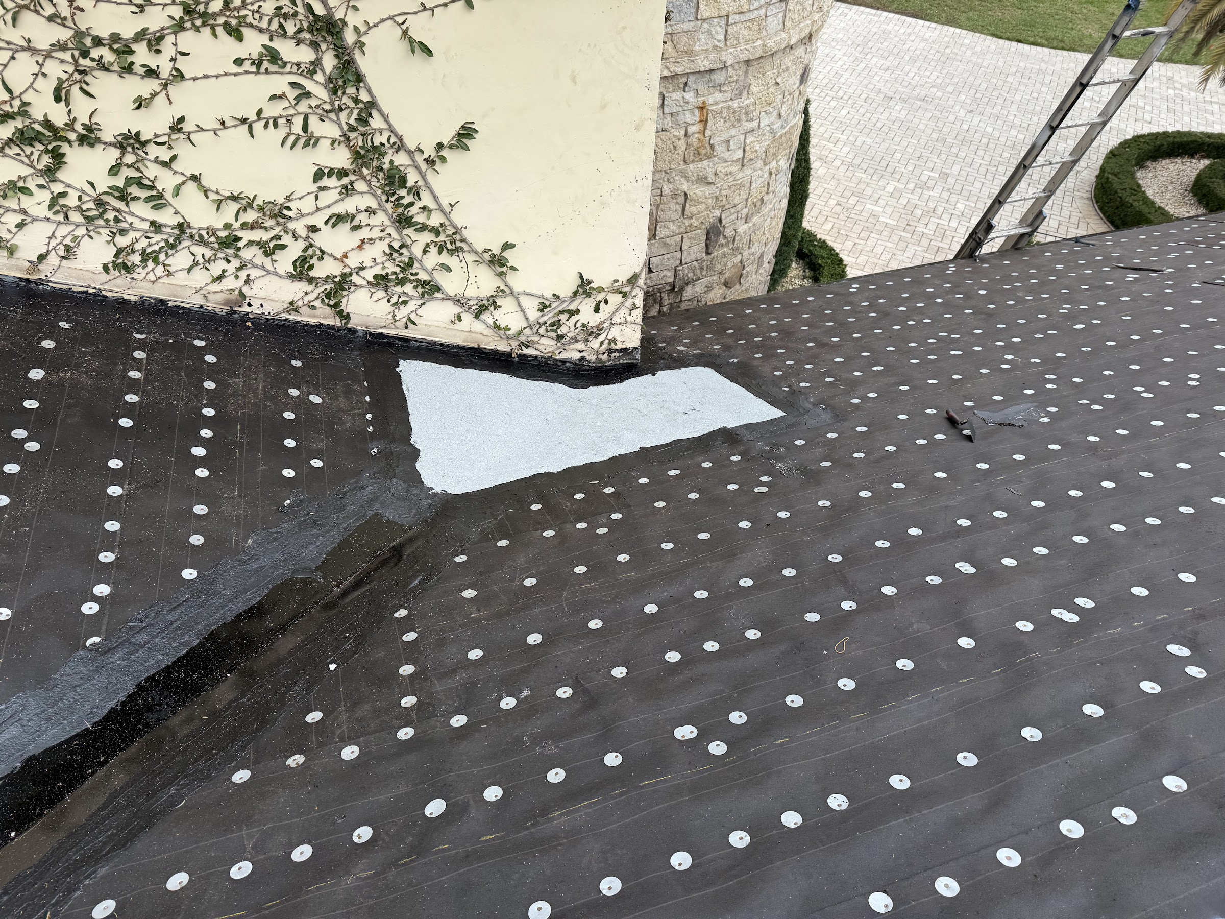 Roof deck with new underlayment during repair